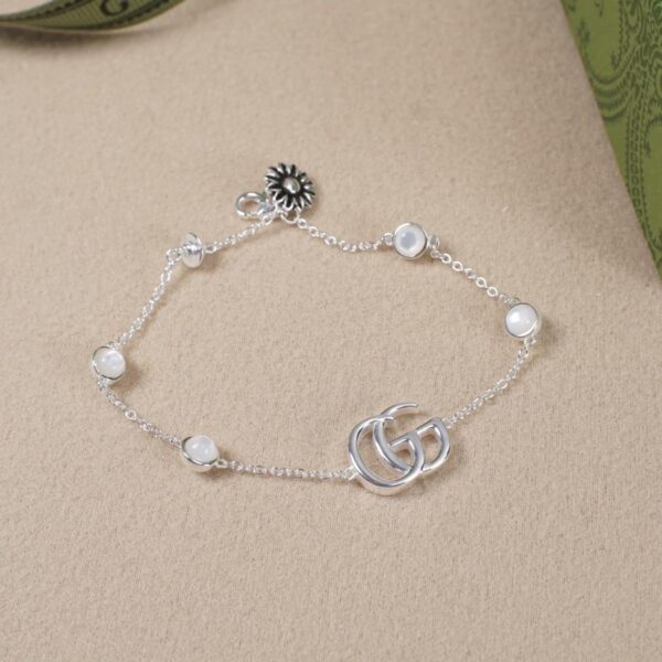 réplica,joyas,joyería,1:1,replica,fake,lujo,barato [Totalmente en plata de ley 925] Pulsera de plata brillante con margarita blanca y doble G entrelazada de Gucci (FEBA)