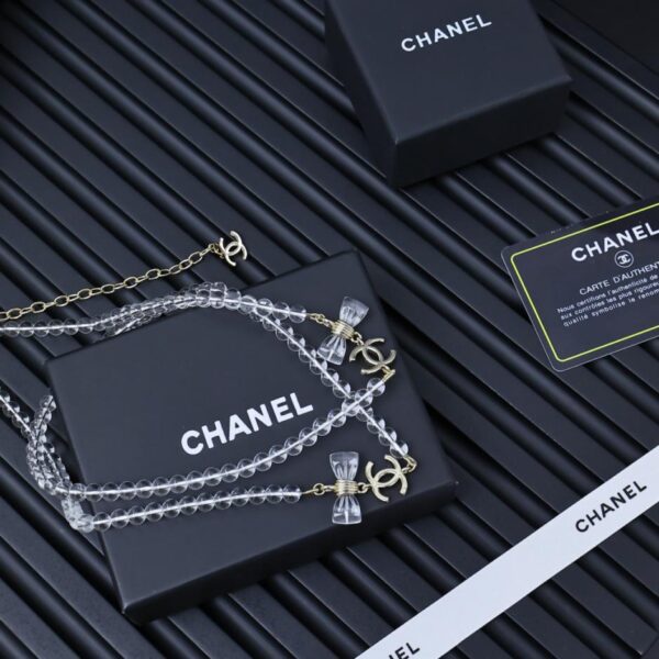réplica,joyas,joyería,1:1,replica,fake,lujo,barato Cadena de suéter con lazo doble transparente de acrílico Chanel de 25 peniques (KL8UG)
