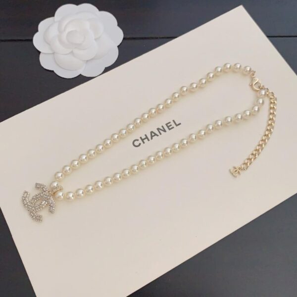 réplica,joyas,joyería,1:1,replica,fake,lujo,barato Pendientes Chanel 25A con corazón hueco y perla en oro con diseño de diamantes (QQSWK)