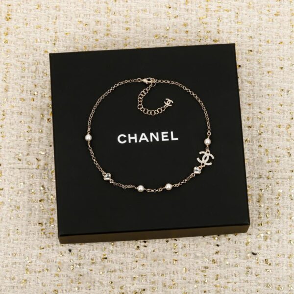 réplica,joyas,joyería,1:1,replica,fake,lujo,barato Boutique / Pendientes Chanel con lazo de corazón y esmalte blanco (SRW0C)